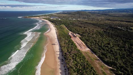 bogangar beach with lush vegetation in new south wales, australia - drone shot