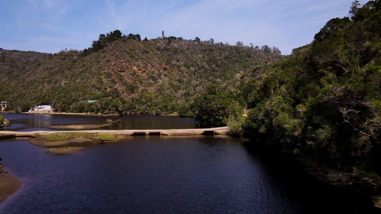 Flight along Kaaimans river, surrounded by dense evergreen forest, Garden Route