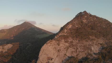 aerial backward over mountains with pico do facho in background, portugal