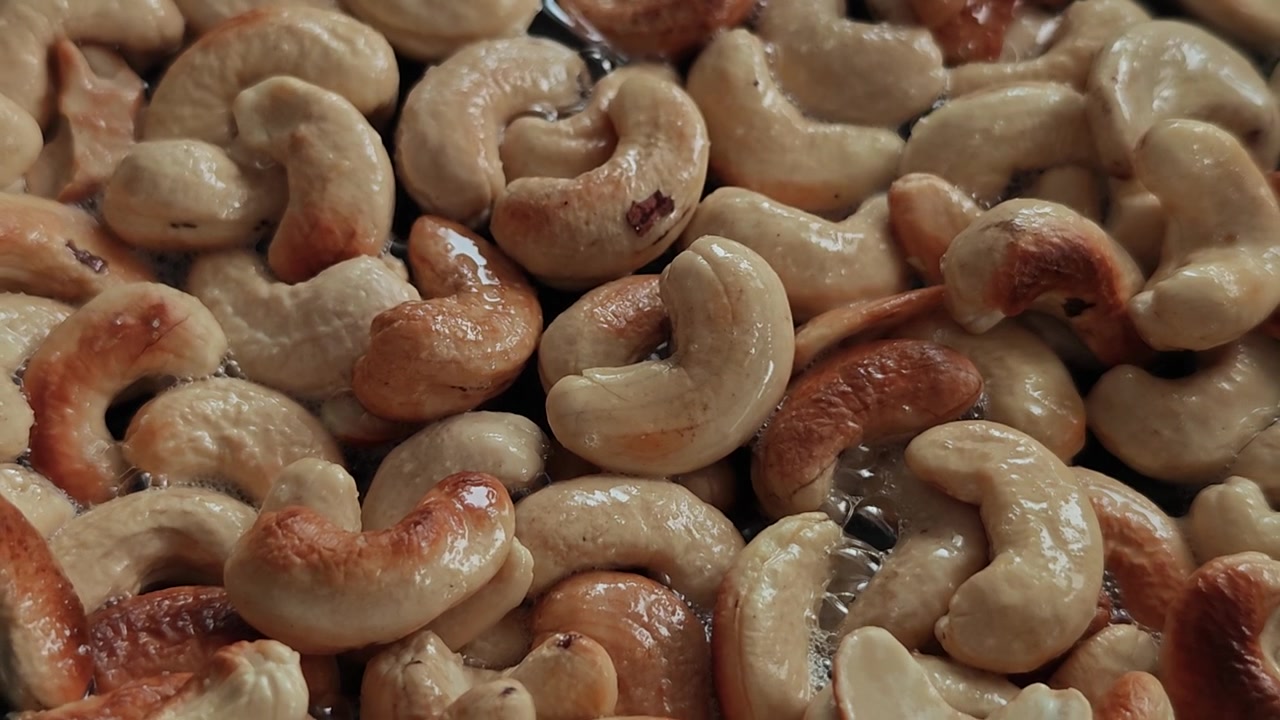 Ultra Cinematic Slow Motion Cashew Roasting in Black Pan with Olive Oil Sparks, Macro Food Art Close-Up, Crunchy Golden Transformation, Gourmet Kitchen ASMR Visual Feast 4K HDR Viral Stock Footage NOW
