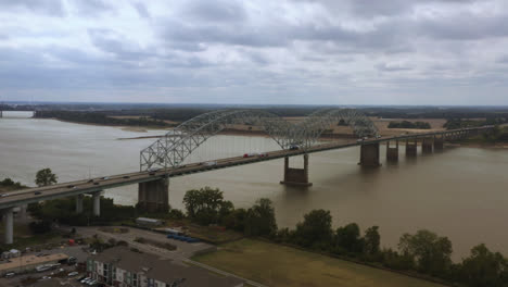Aerial-tracking-shot-of-the-Hernando-De-Soto-bridge-in-Memphis-Tennessee-looking-back-at-West-Memphis,-Arkansas