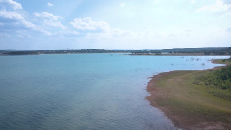 Aerial-shots-of-a-lake-park-in-Texas-on-the-popular-Canyon-Lake-while-barely-any-boats-are-cruising-around