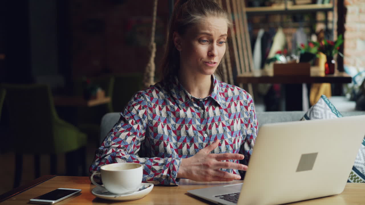 Woman having a video call in a coffee shop