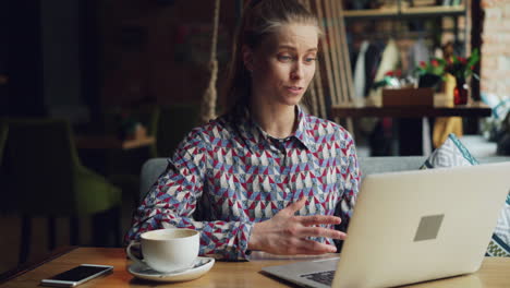 woman having a video call in a coffee shop