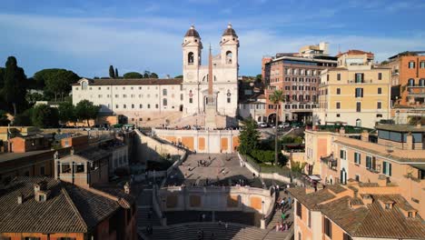 cinematic pull out drone shot reveals rome's famous spanish steps