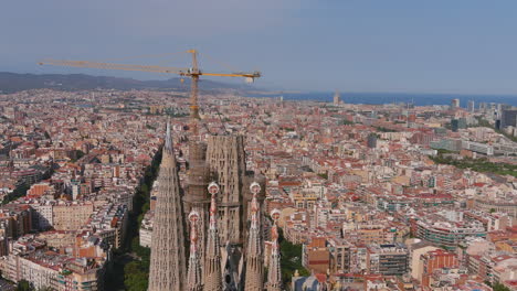 sagrada familia top and crane aerial orbit 4k