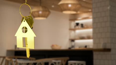 house keys and key fob hanging over out of focus kitchen 4k
