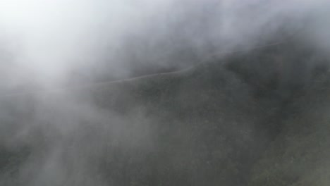 Aerial-flight-through-cloud-to-famous-Death-Road-in-Bolivia-mountains