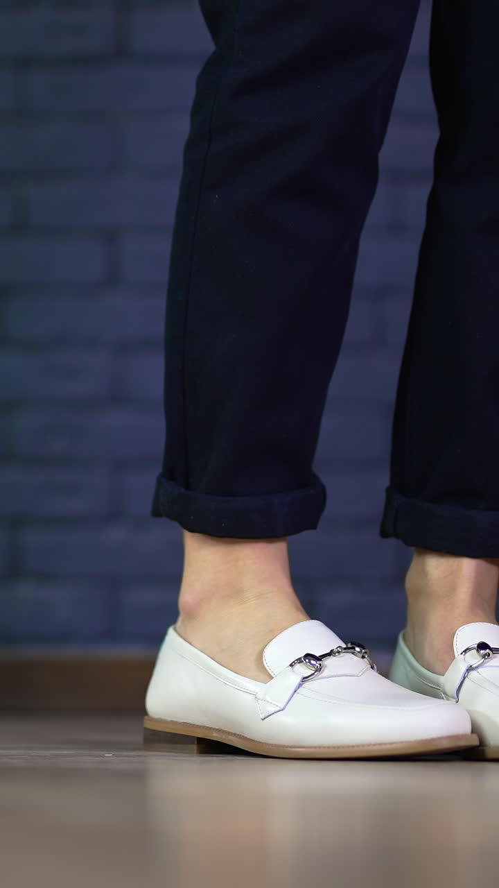 Close up view of shoes dancing. Lifestyle footwear dancing on the floor. Vertical video