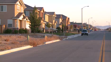 tract homes line a street in a suburban sprawl community near palmdale california