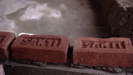 brick-and-concrete-in-building-construction-site-labor-working-class-close-up