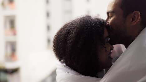 couple hug, blanket kiss and dancing in living