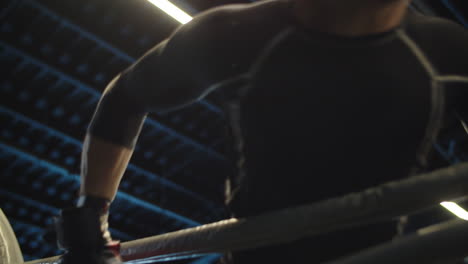 Angry-sport-man-starting-to-attack-at-gym.-Boxer-starting-fight-on-boxing-ring