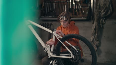 serious dedication: teenager's passion for bike maintenance and repair in the workshop