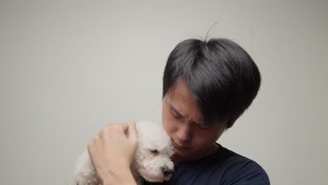 chinese man with toy poodle companion. white background