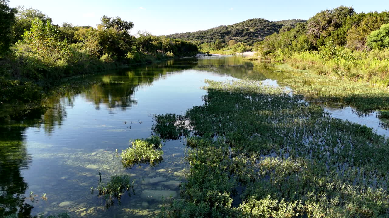 A sweeping aerial view of a river in the Texas Hill Country
