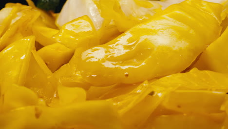 close-up of fermented yellow cabbage on plate. preservation of vegetables in glass jars. fermentation preserved vegetables. sauerkraut with spices.