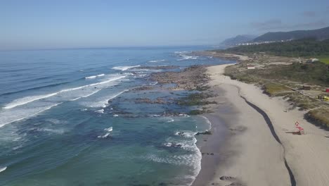 Aerial-wide-view-towards-of-relaxing-Portuguese-beach-of-Afife,-Viana-do-Castelo,-Portugal