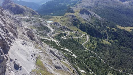 Valparola-mountain-pass-and-lake-in-Dolomites-Italy,-aerial-wide-view