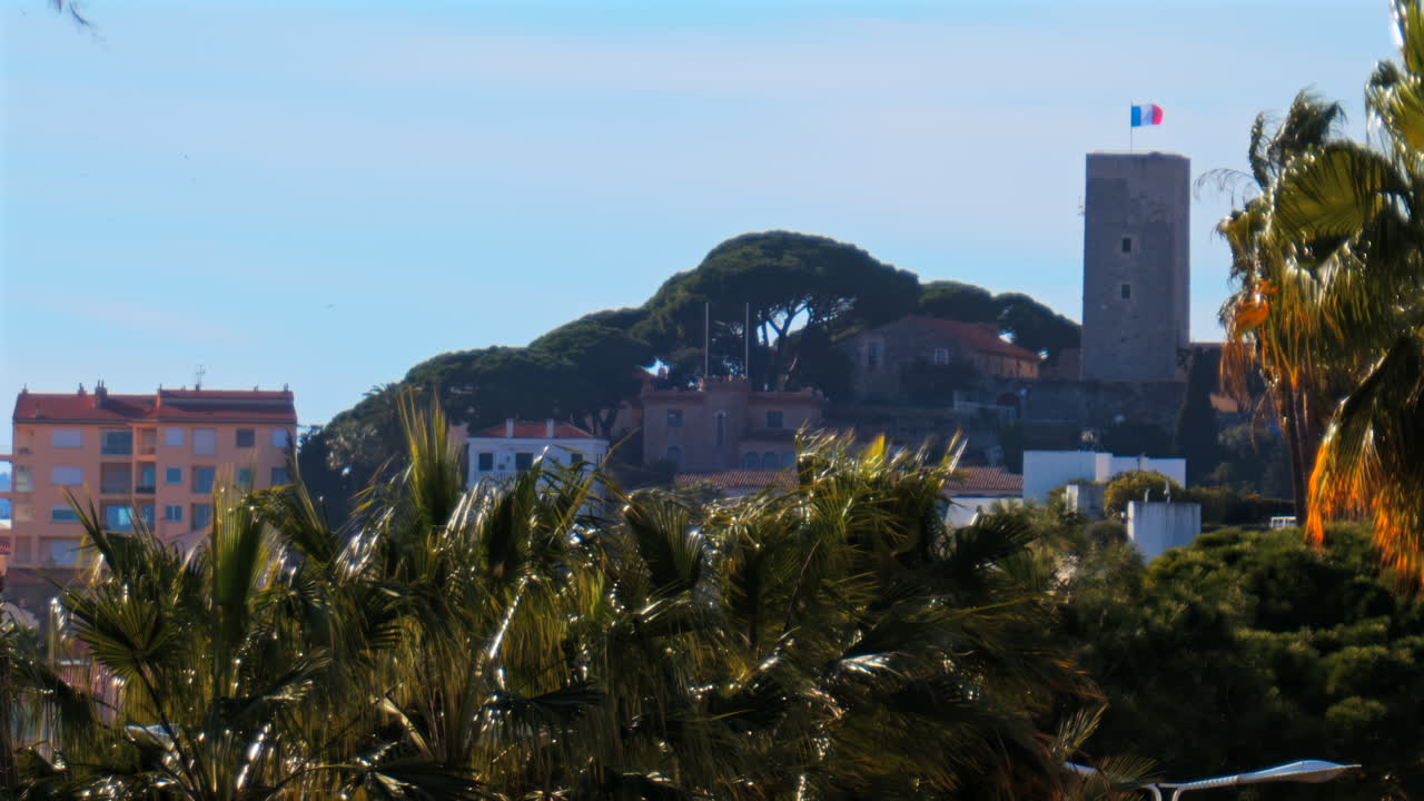 Distant view of the Goya Museum in Castres, France with the french flag on top of it