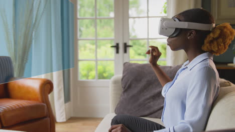 woman looking at projected screen sitting on sofa at home wearing vr headset using ar technology