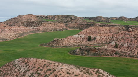 Rocky-hill-and-green-grass-fields-Spain-landscape-countryside-agriculture