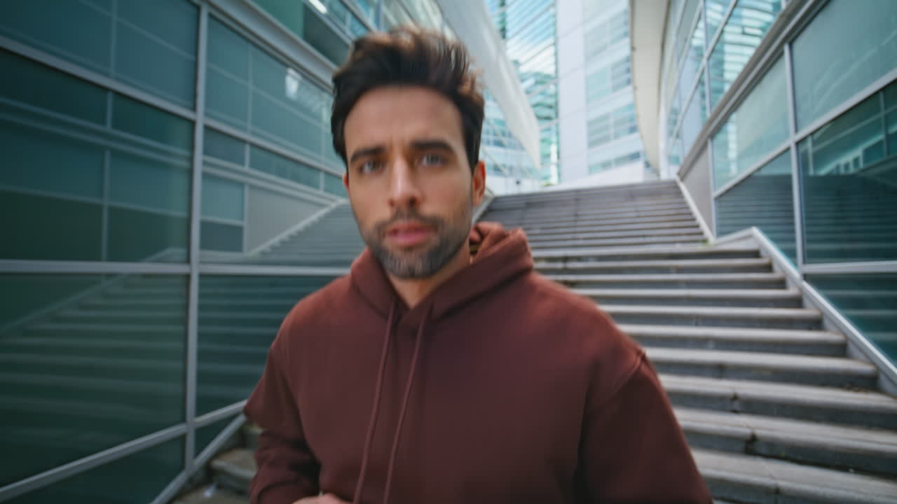 Closeup urban sportsman workout at modern stairs. athlete warming up