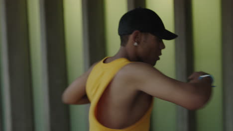 dancing-man-young-happy-street-dancer-performing-various-freestyle-dance-moves-fit-mixed-race-male-practicing-wearing-yellow-vest-close-up