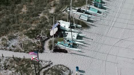 small-waterplane area with a twin hull with a mooring cover resting on the beach of delray in florida