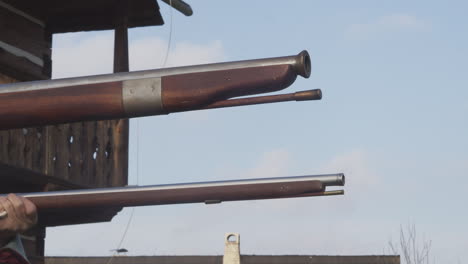 old medieval muskets close-up, shot and fire from head muskets, side view slow motion