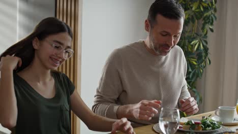 Caucasian-family-having-a-vivid-conversation-at-the-breakfast.