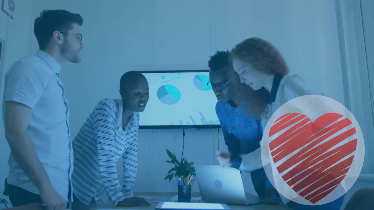 Animation of heart over diverse business people in office