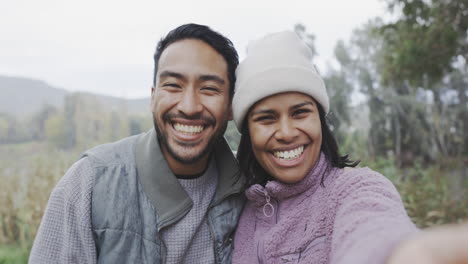 Couple,-hiking-in-nature-and-selfie-of-adventure