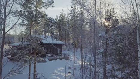 Hidden-Off-grid-cabin-in-pristine-winter-woods,-Dolly-Crane-shot