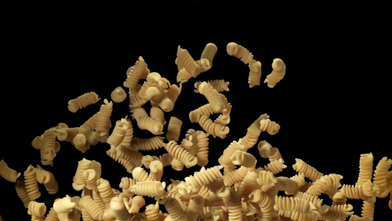 Dry Fusilli Pasta Falling and Rising in Slow Motion