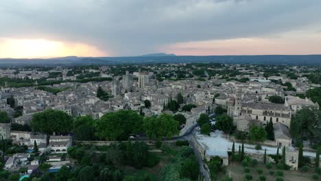 historic town of uzes at sunset in gard, occitanie region of southern france. aerial drone shot