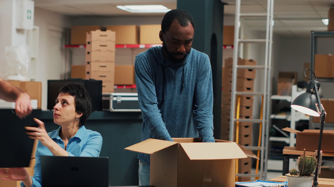 Warehouse workers packing boxes