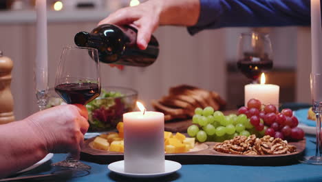 Close-up-pouring-wine-in-glass