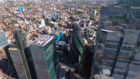 close up aerial view of bishopsgate, nat west tower and the gherkin towers, city of london, uk