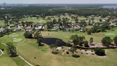 golf course with luxury villas on sunny day in panama city, florida