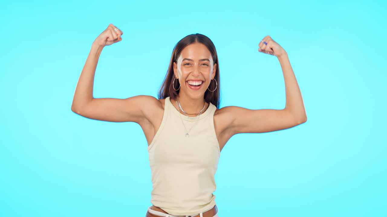 Face, funny and woman flex muscle in studio