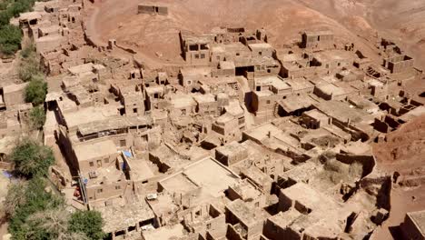 Tuyoq-valley-establishment-overview-in-Xinjiang,-Tuyuk-aerial-of-oasis-village-in-the-Taklamakan-desert,-Flaming-Mountains,-Xinjiang-Uighur,-Region-of-China