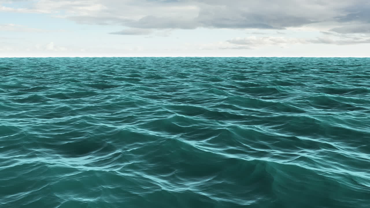 Choppy blue ocean under cloudy sky 