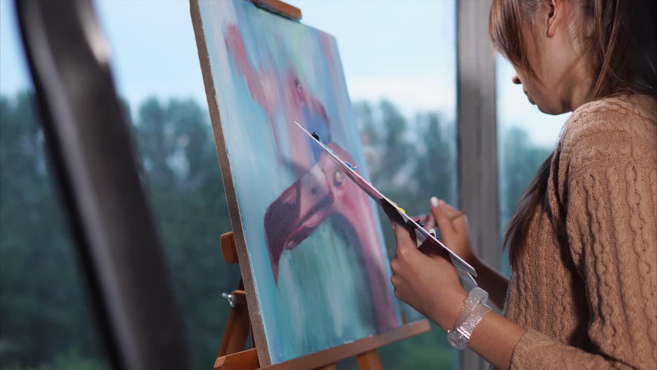 Woman painting a Flamingo