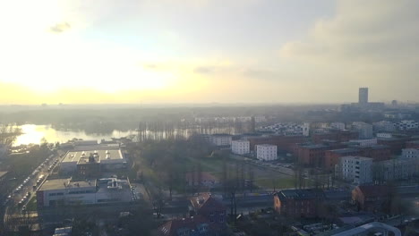 drone paning above berlin heading towards the sun