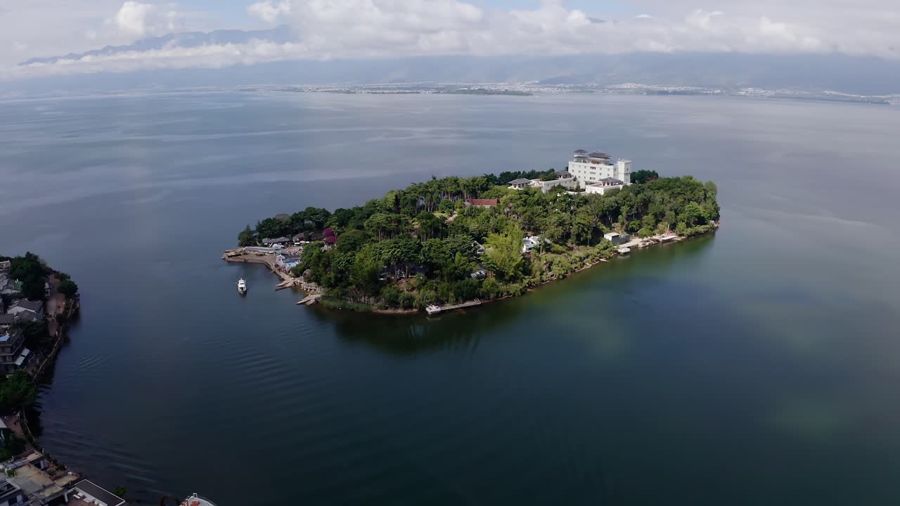 Village and lake in Shuanglang, Yunnan, China.