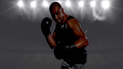 Animation-of-male-boxer-over-spotlights-and-sports-stadium