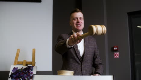 man in elegant suit with gavel