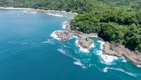 coral rocks and sandy beach of wediombo lagoon, indonesia, aerial panorama