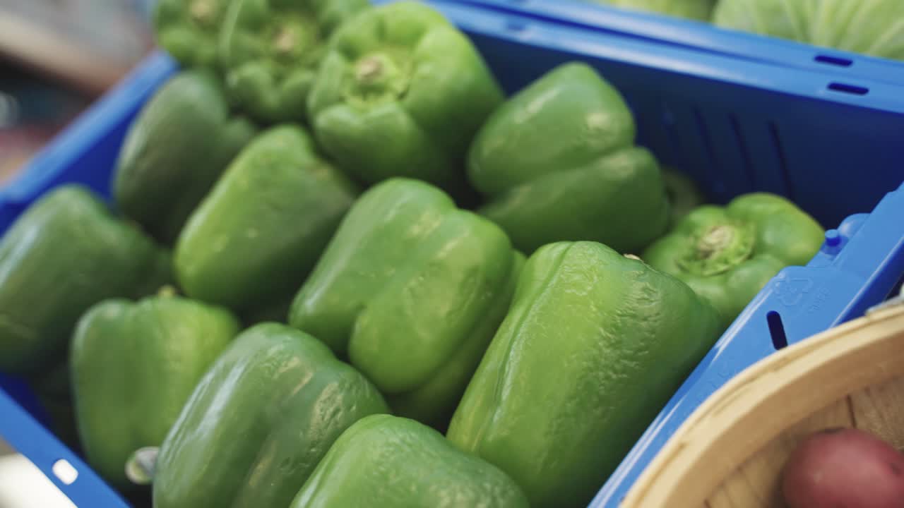 Closeup view of fresh green pepper in food shelfs in grocery store.